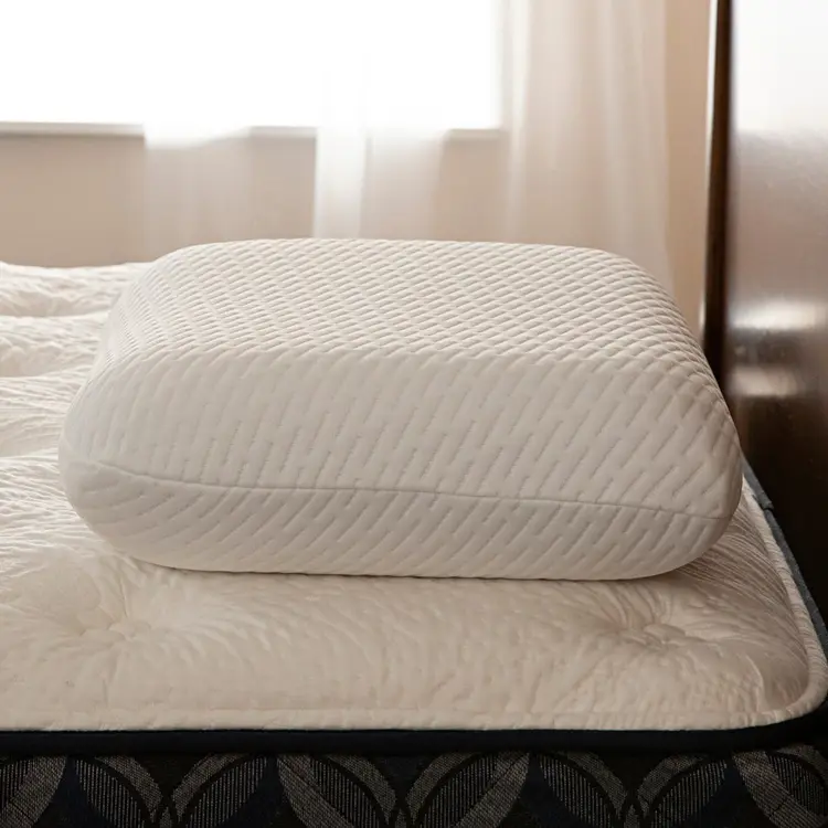 Serta Nightstar pillow on a bed with a blurred background