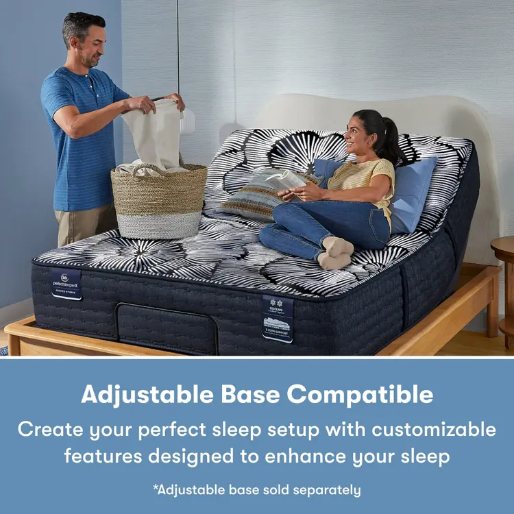 Man standing to the left of and a woman laying on a Perfect Sleeper X Quilted Hybrid Excelled Extra Firm Mattress sitting in an adjustable base frame || feel: Extra Firm || level: Level 1