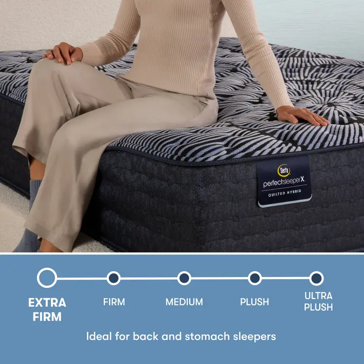 Perfect Sleeper X Quilted Hybrid Excelled Extra Firm comfort scale with a woman sitting on the left side of the mattress || feel: Extra Firm || level: Level 1