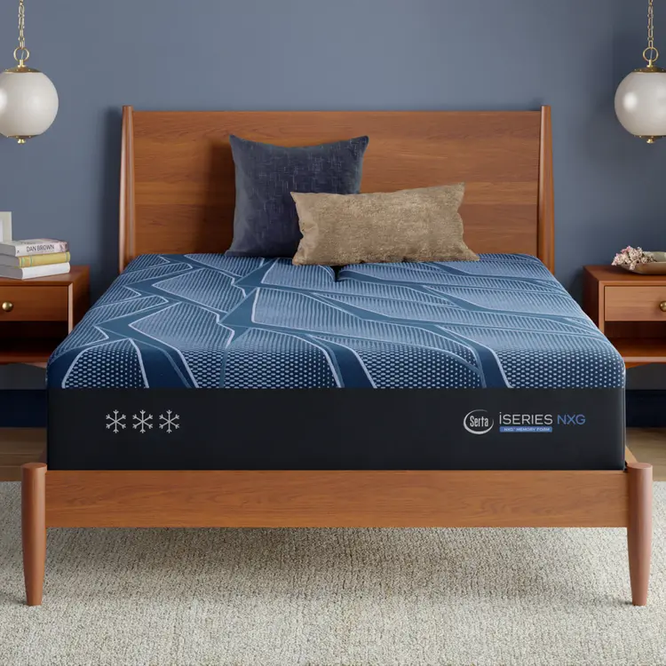 Bed frame with a blue Serta iSeries NXG mattress topper in a bedroom setting